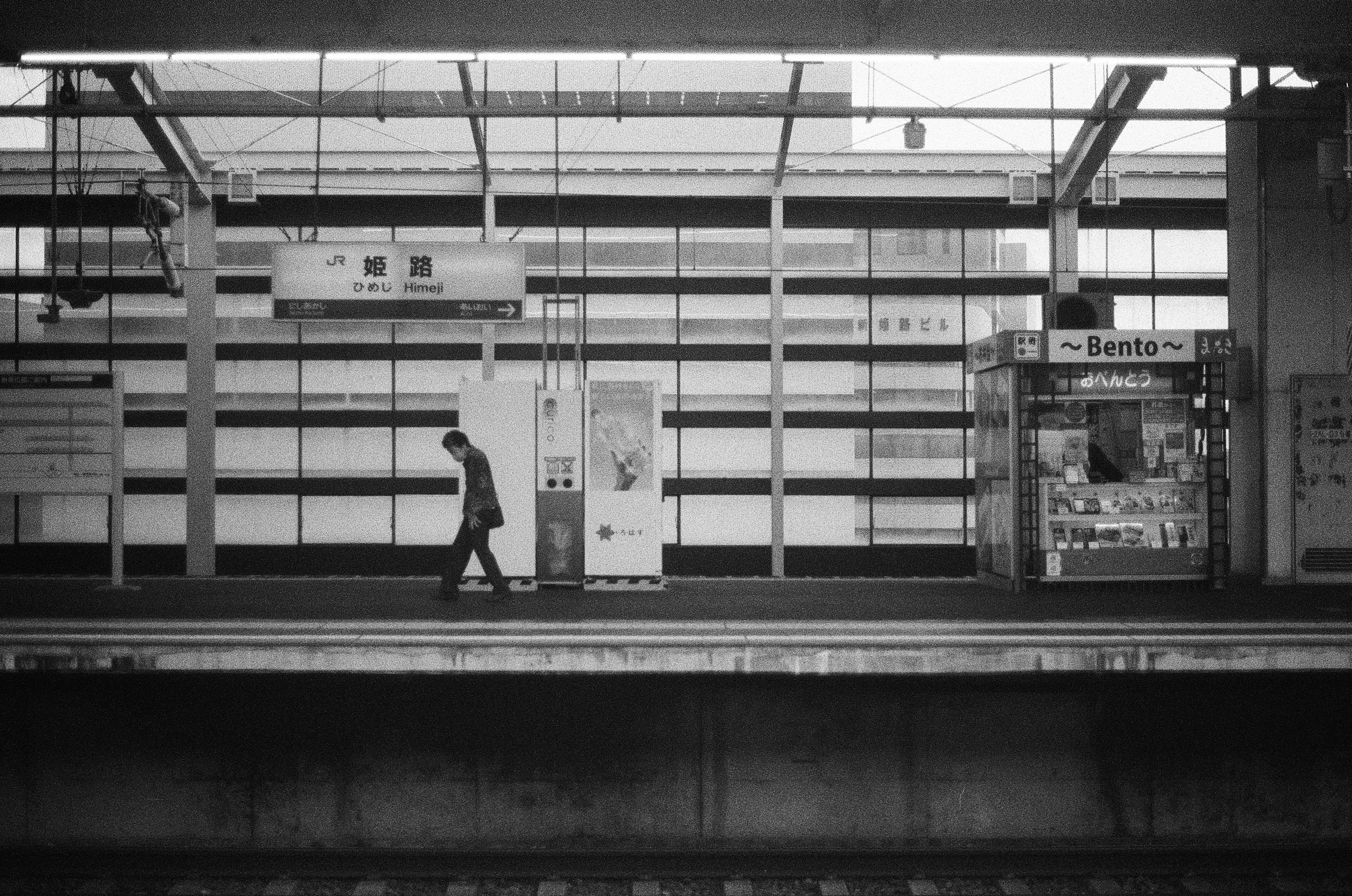 Okayama - A man walks across the empty platform at Okayama Station