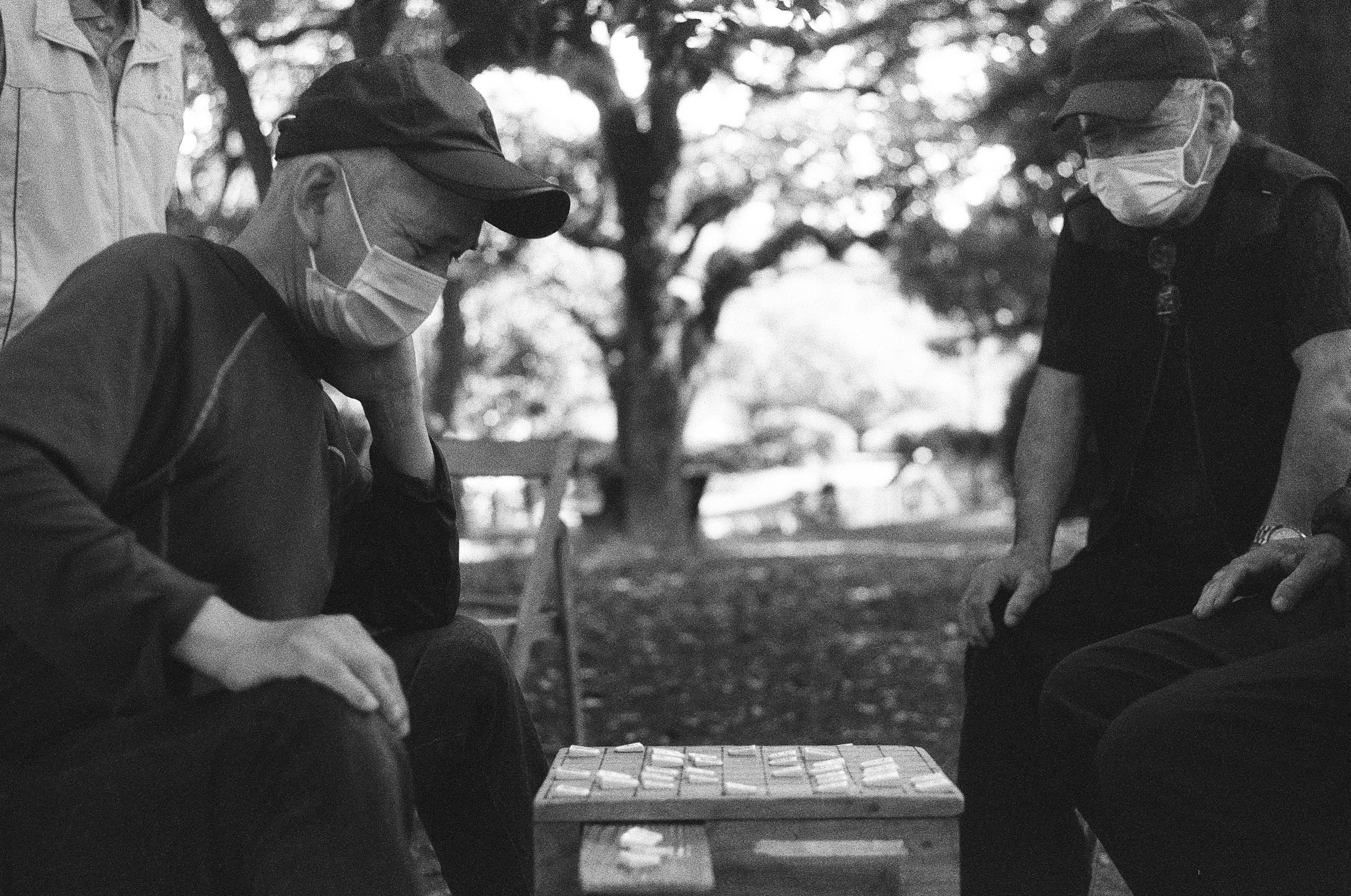 Hiroshima - Men playing Shogi (Japanese Chess) in a park.